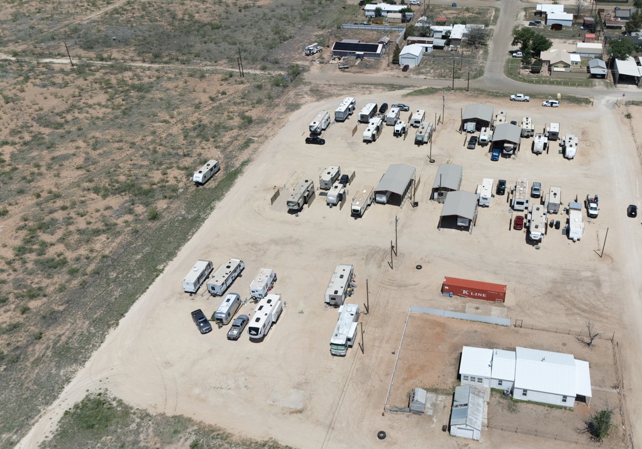 Aerial view of Goldsmith RV Park & Housing showing RV sites and the open caliche ground used for RV and vehicle storage